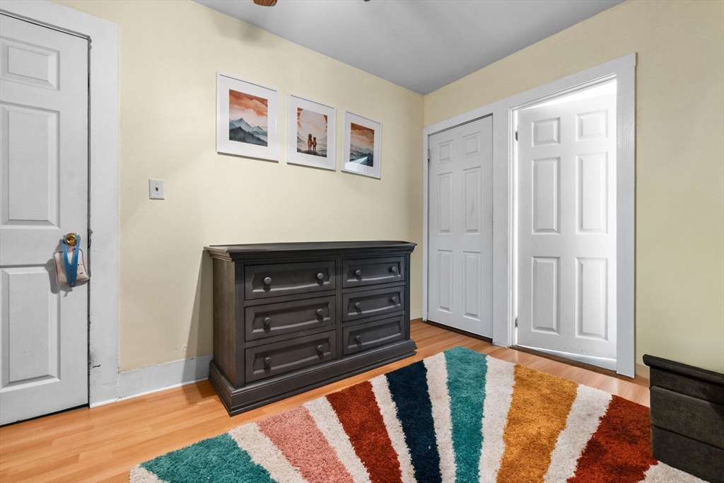 65 Poplar Street Gloucester, MA 01930 - Photo 15 of 23 a bed room with a bed and a television