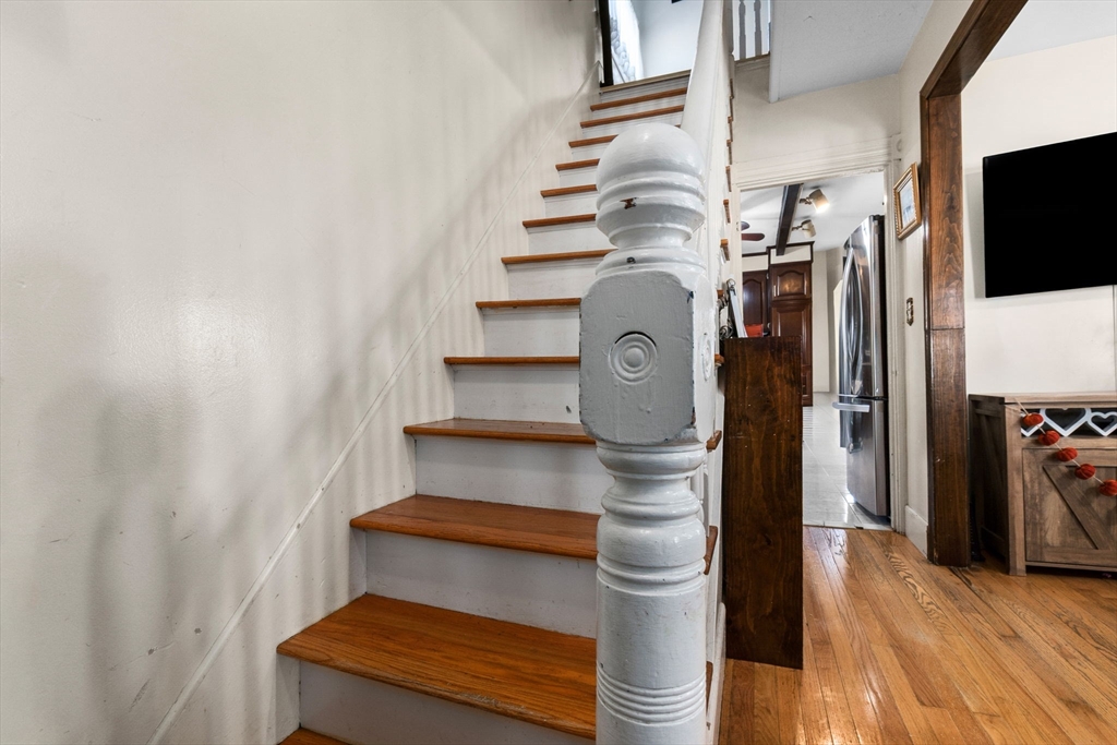 65 Poplar Street Gloucester, MA 01930 - Photo 2 of 23 a view of entryway and hall with wooden floor