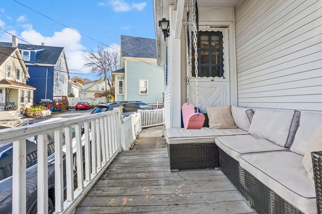 65 Poplar Street Gloucester, MA 01930 - Photo 5 of 23 a bathroom with a sink a mirror and bathtub
