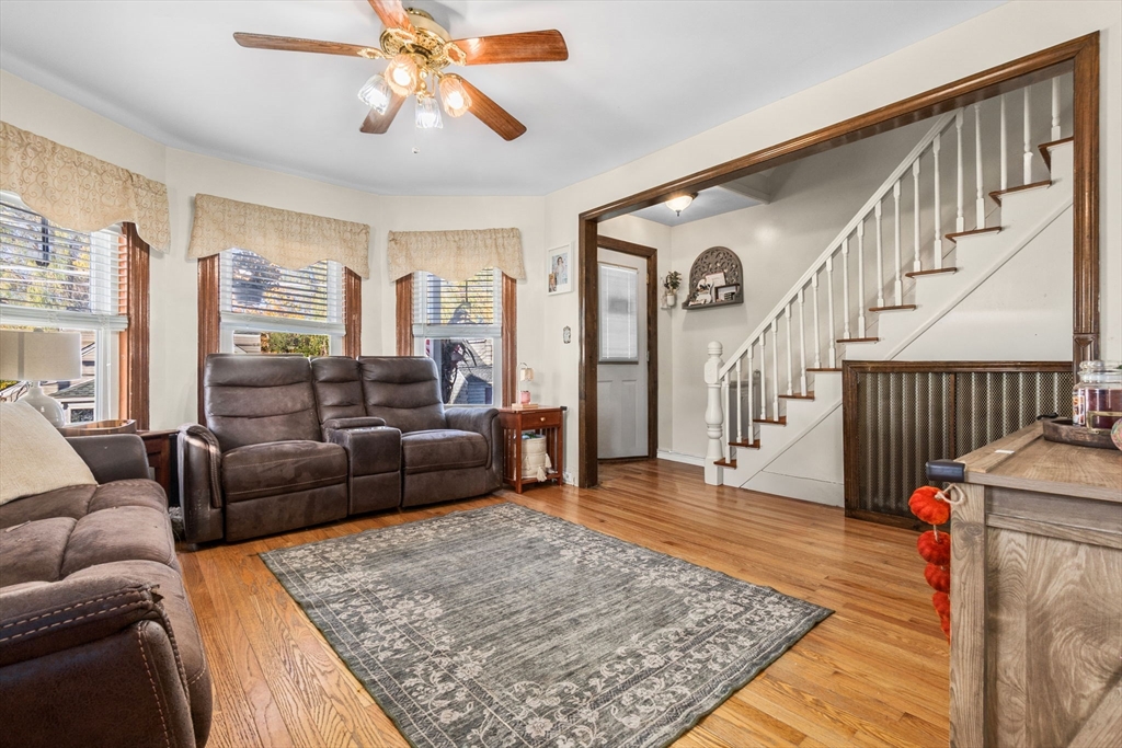 65 Poplar Street Gloucester, MA 01930 - Photo 6 of 23 a living room with furniture and a rug