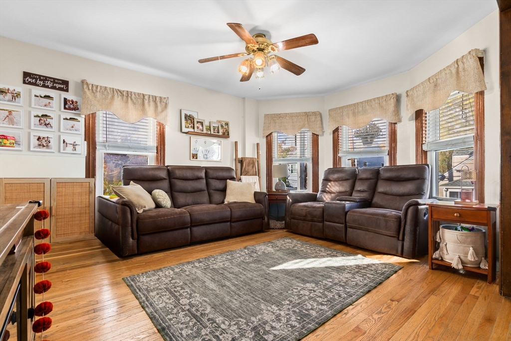 65 Poplar Street Gloucester, MA 01930 - Photo 7 of 23 a living room with furniture wooden floor and a table