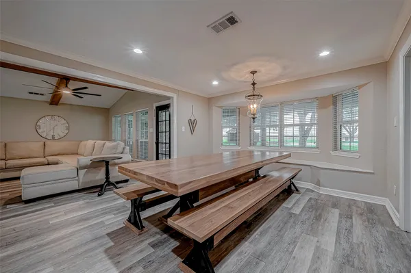 a large hall with stainless steel appliances granite countertop a lot of counter space