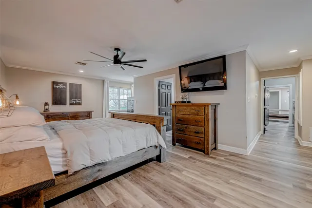 a bedroom with furniture and a window