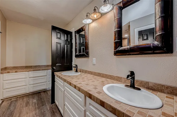 a bathroom with a shower and a glass door