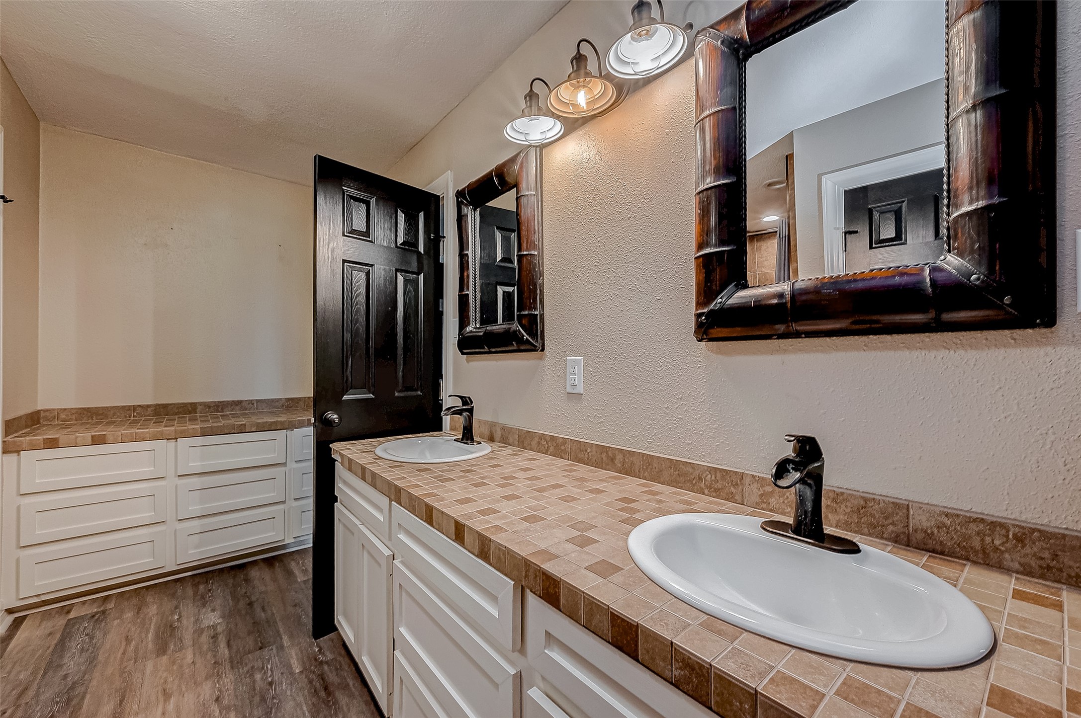 3819 Cottonwood School Road Rosenberg, TX 77471 - Photo 24 of 37 a bathroom with a granite countertop sink a mirror and vanity