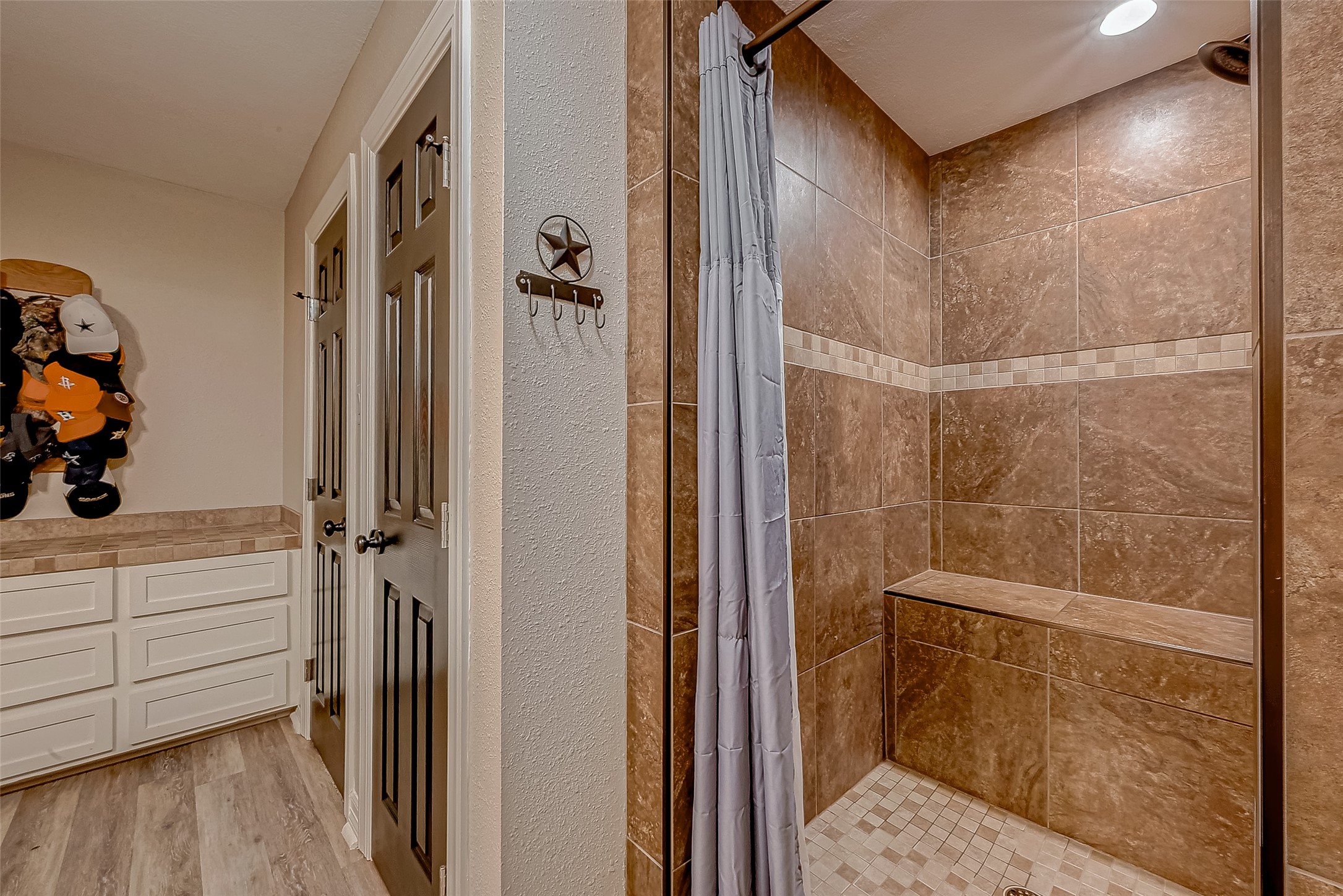 3819 Cottonwood School Road Rosenberg, TX 77471 - Photo 25 of 37 a bathroom with a shower and a glass door