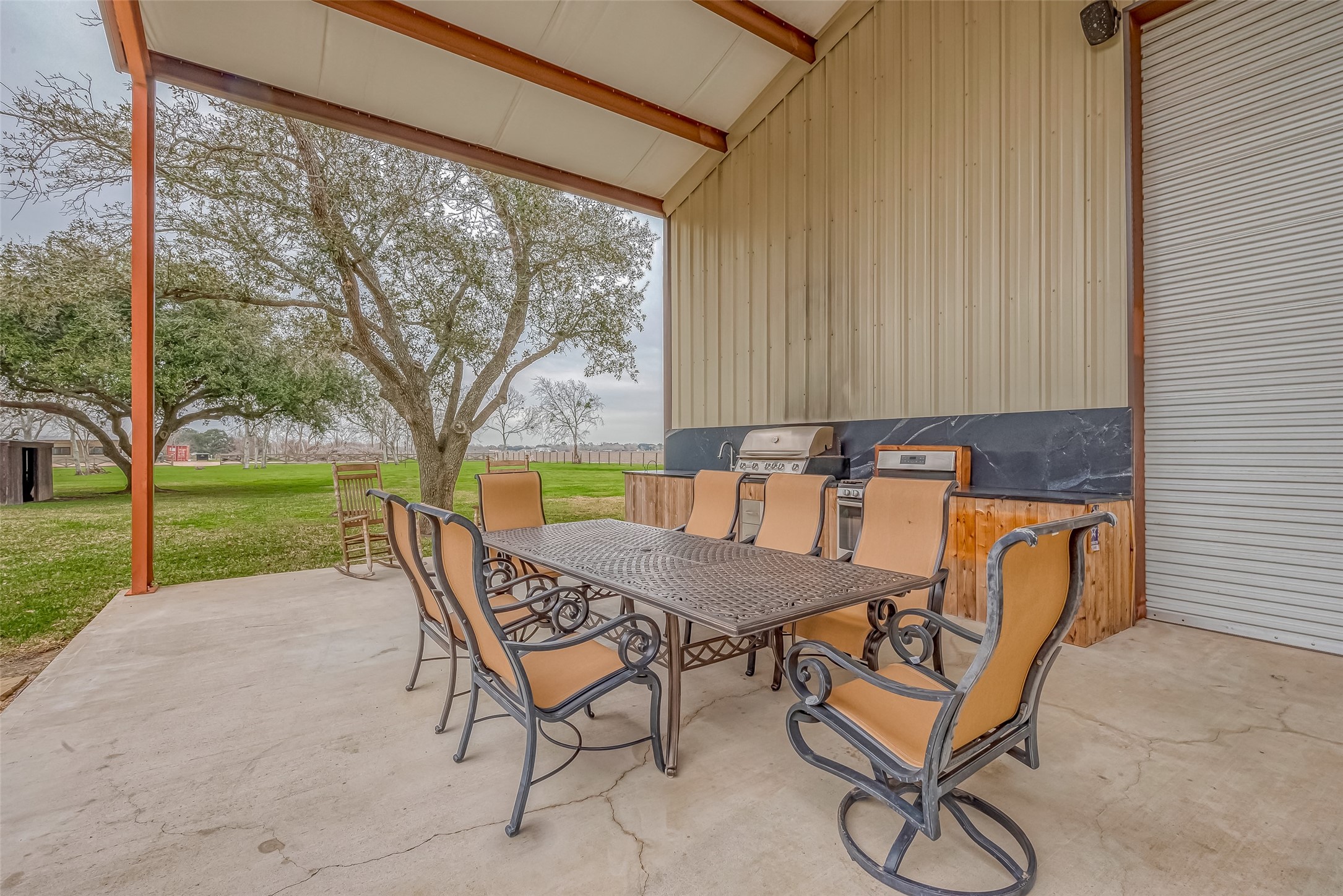 3819 Cottonwood School Road Rosenberg, TX 77471 - Photo 29 of 37 a roof deck with table and chairs and garden view