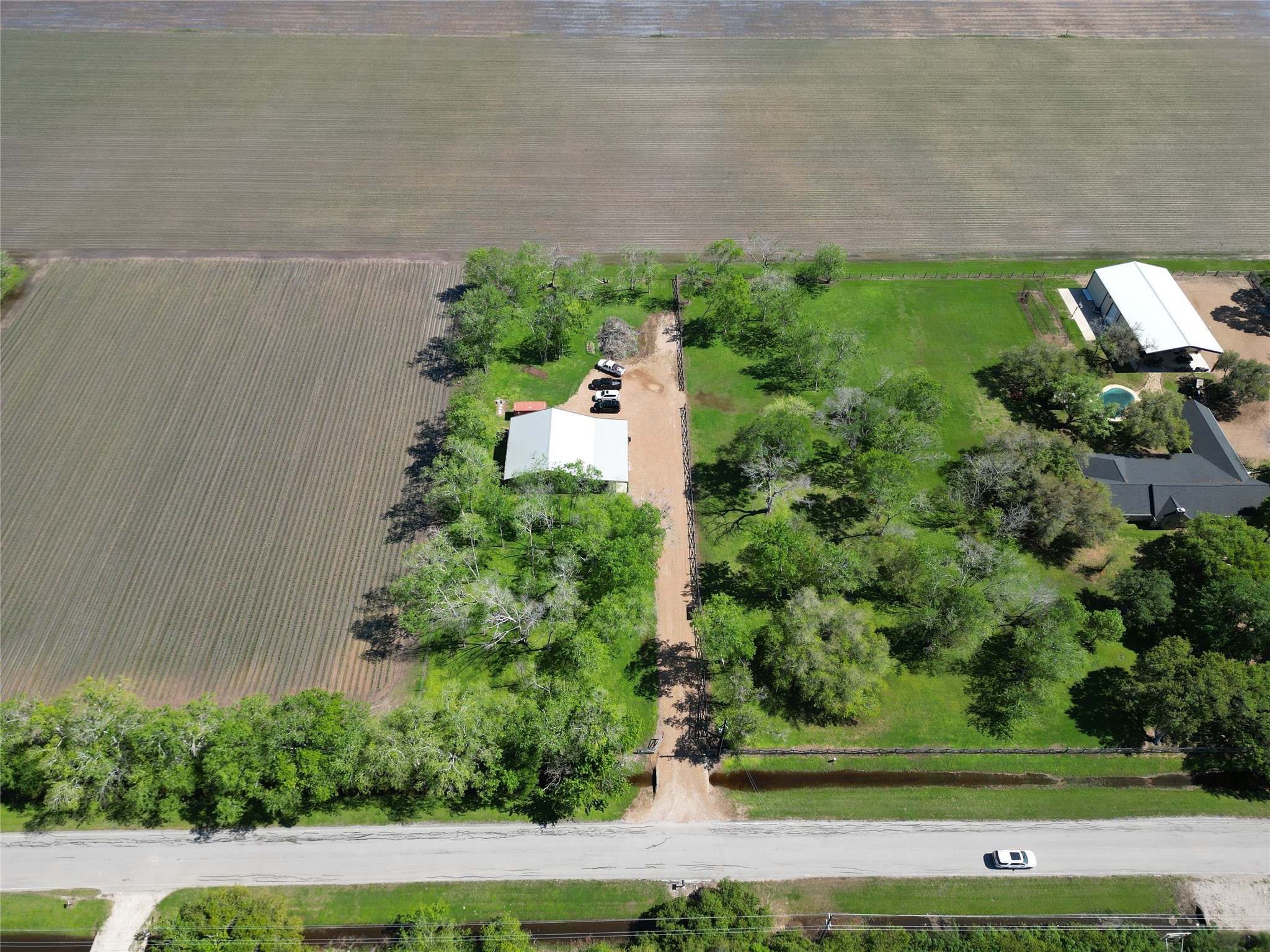 3819 Cottonwood School Road Rosenberg, TX 77471 - Photo 4 of 37 an aerial view of a house with a yard