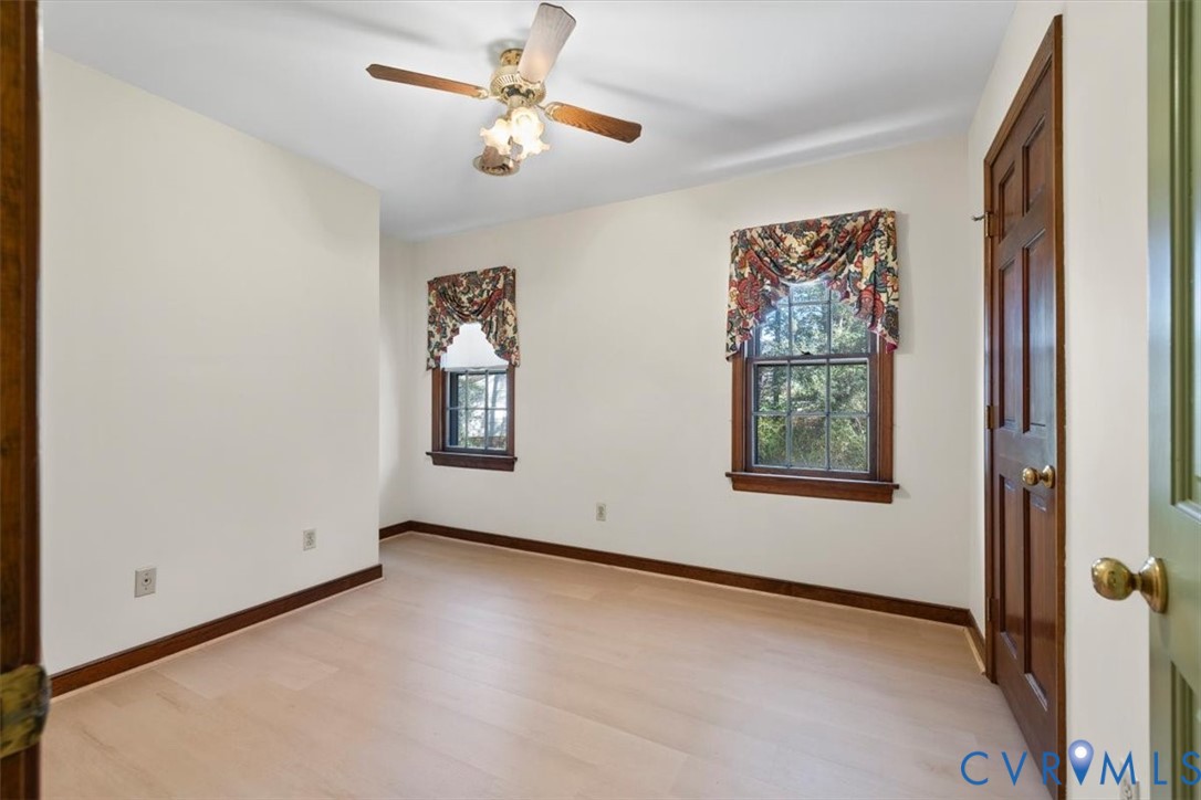 11716 Ivywood Road Chester, VA 23831 - Photo 21 of 38 an empty room with windows and fan