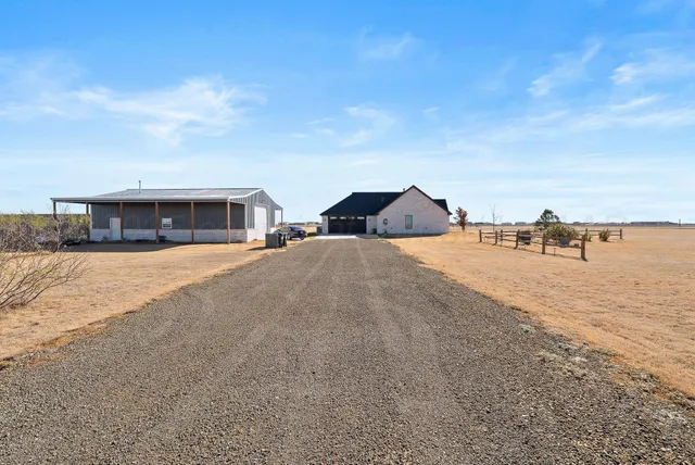 a view of houses with yard