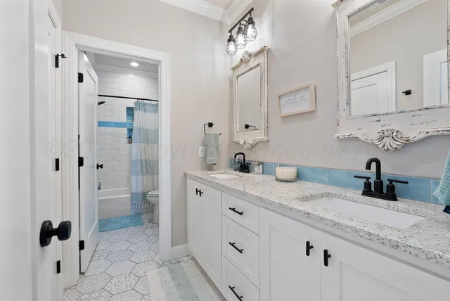 a utility room with sink dryer and washer