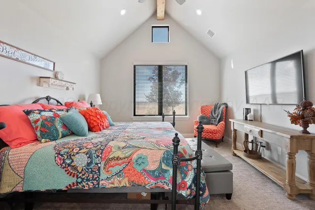 a bedroom with bed and window