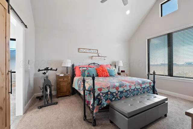 a bedroom with bed and a window