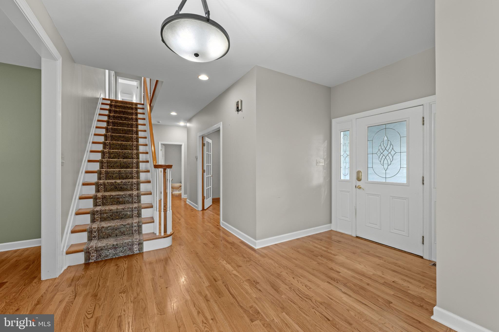 113 Bentons Pleasure Road Chester, MD 21619 - Photo 12 of 53 Inviting foyer with elegant staircase.