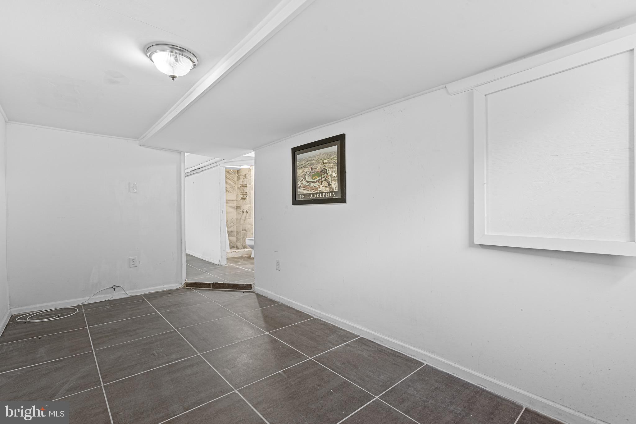 305 Margate Road Upper Darby, PA 19082 - Photo 13 of 20 a view of an empty room with a window