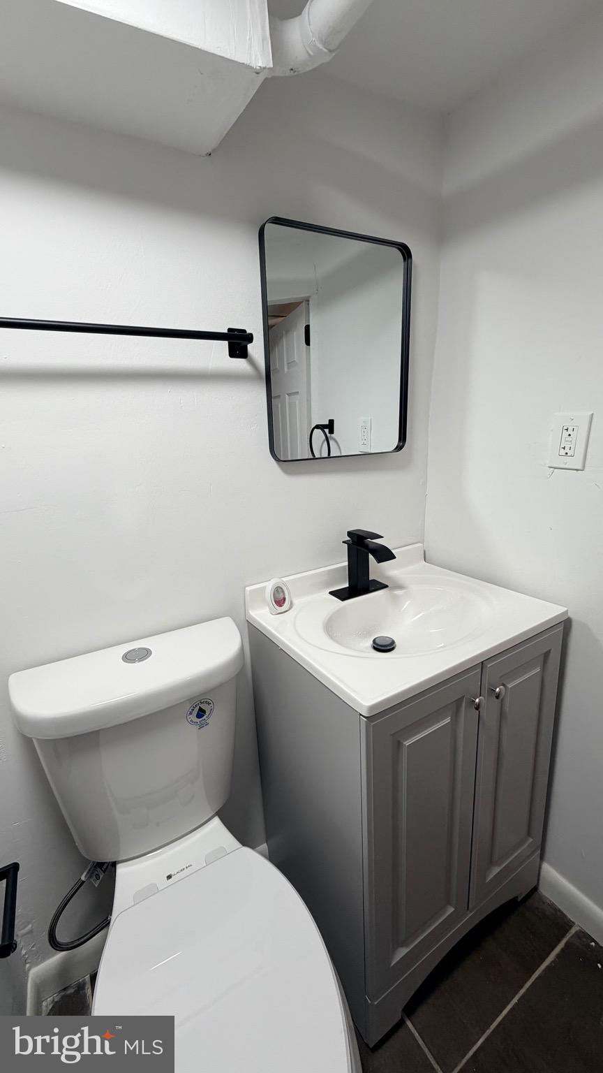 305 Margate Road Upper Darby, PA 19082 - Photo 14 of 20 a bathroom with a toilet sink and mirror