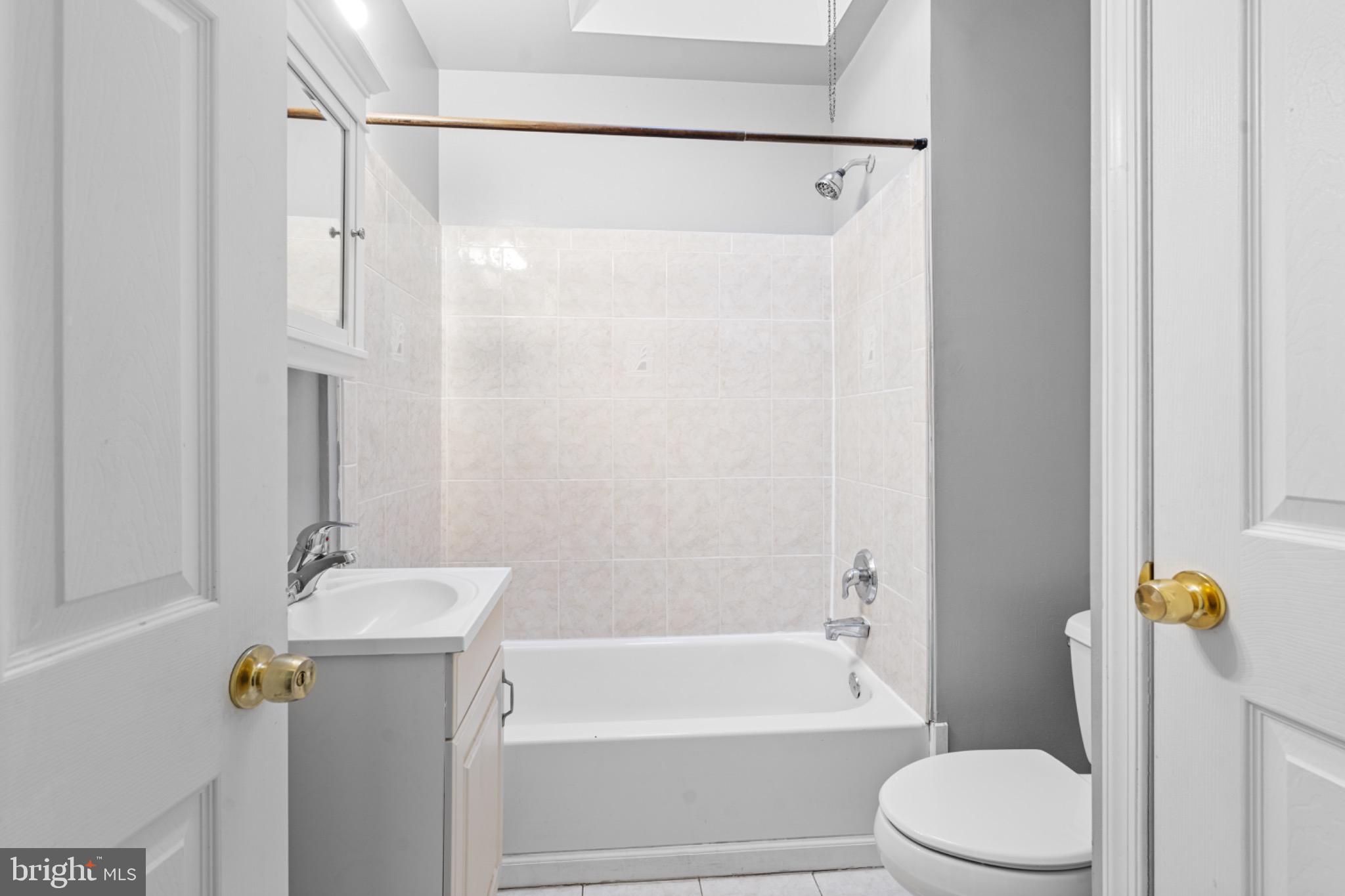 305 Margate Road Upper Darby, PA 19082 - Photo 6 of 20 a bathroom with a sink toilet and shower