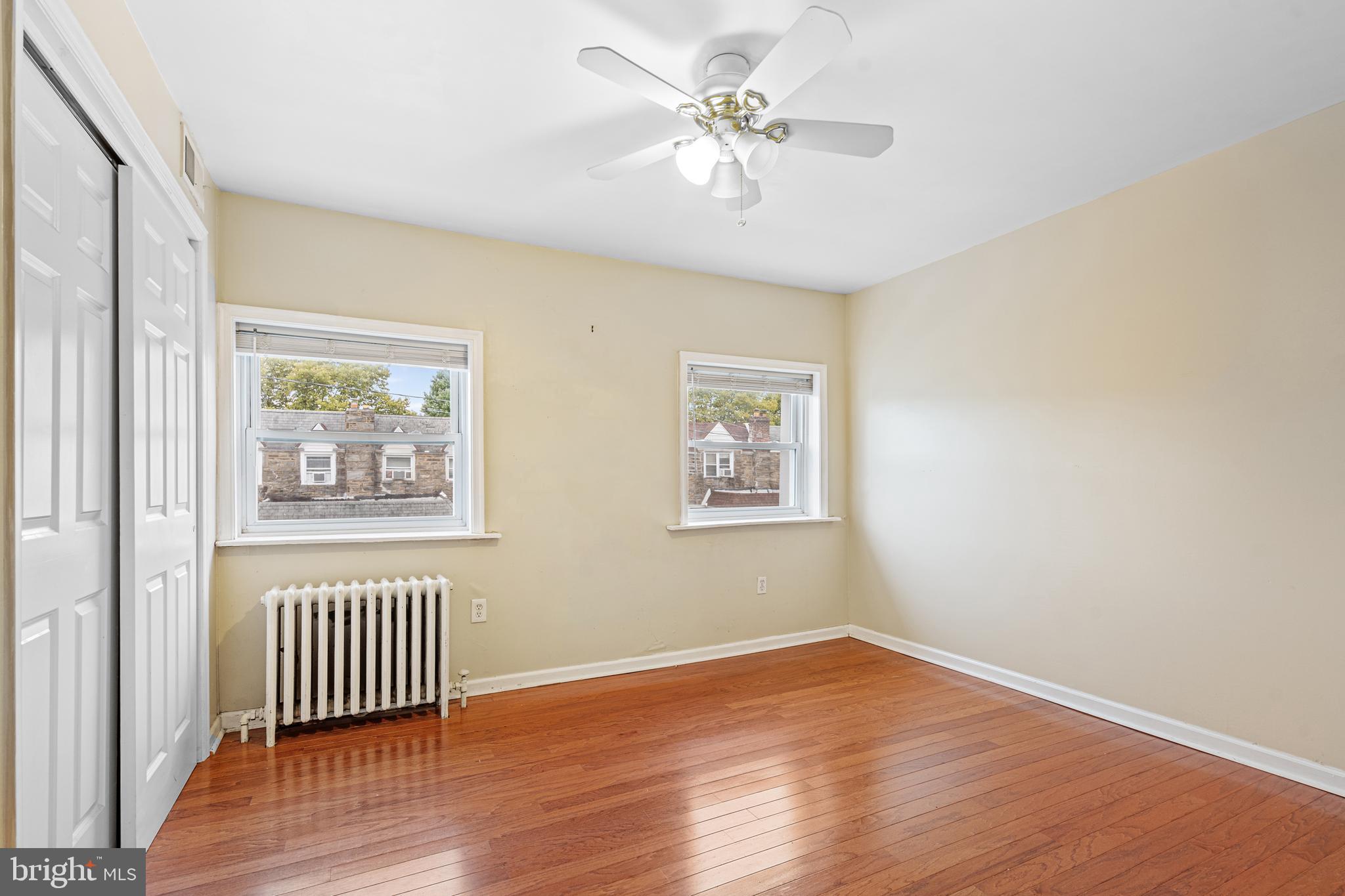 305 Margate Road Upper Darby, PA 19082 - Photo 9 of 20 a view of an empty room with a window and wooden floor