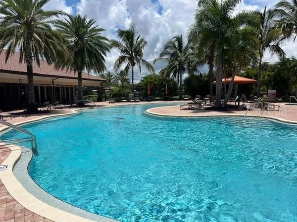 a view of a swimming pool with a table and chairs