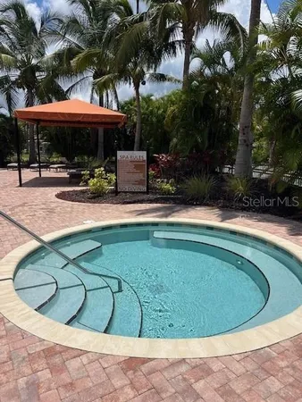 a view of a swimming pool with a patio
