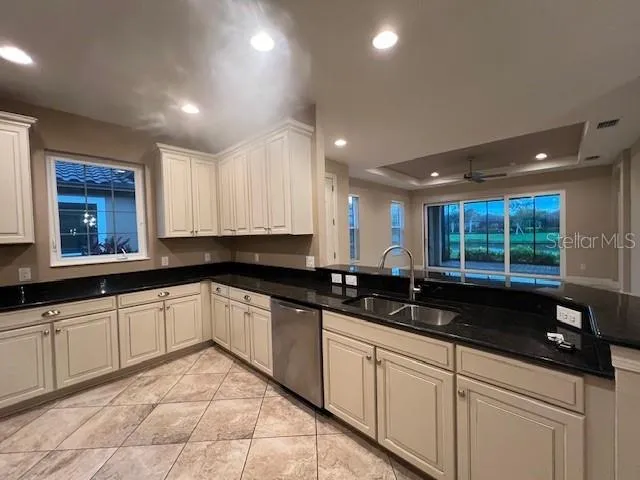 a kitchen with a sink and cabinets