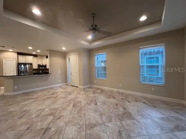 a view of an empty room with a window