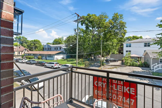 a view of a balcony with potted plants