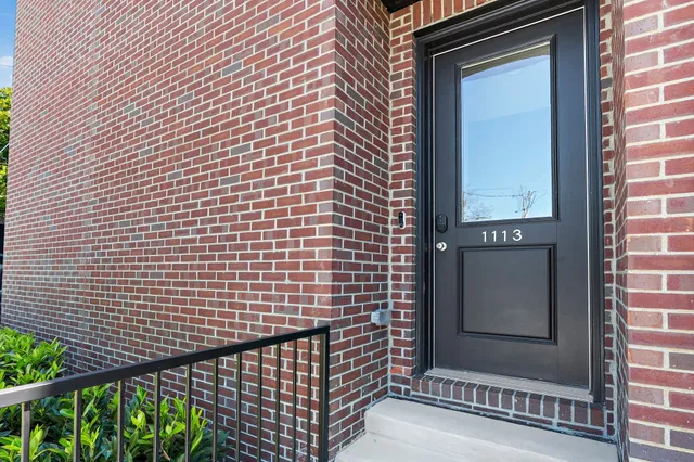 a view of a brick house with a door