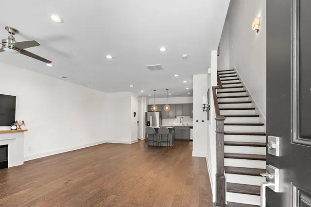 a view of kitchen with sink and natural light