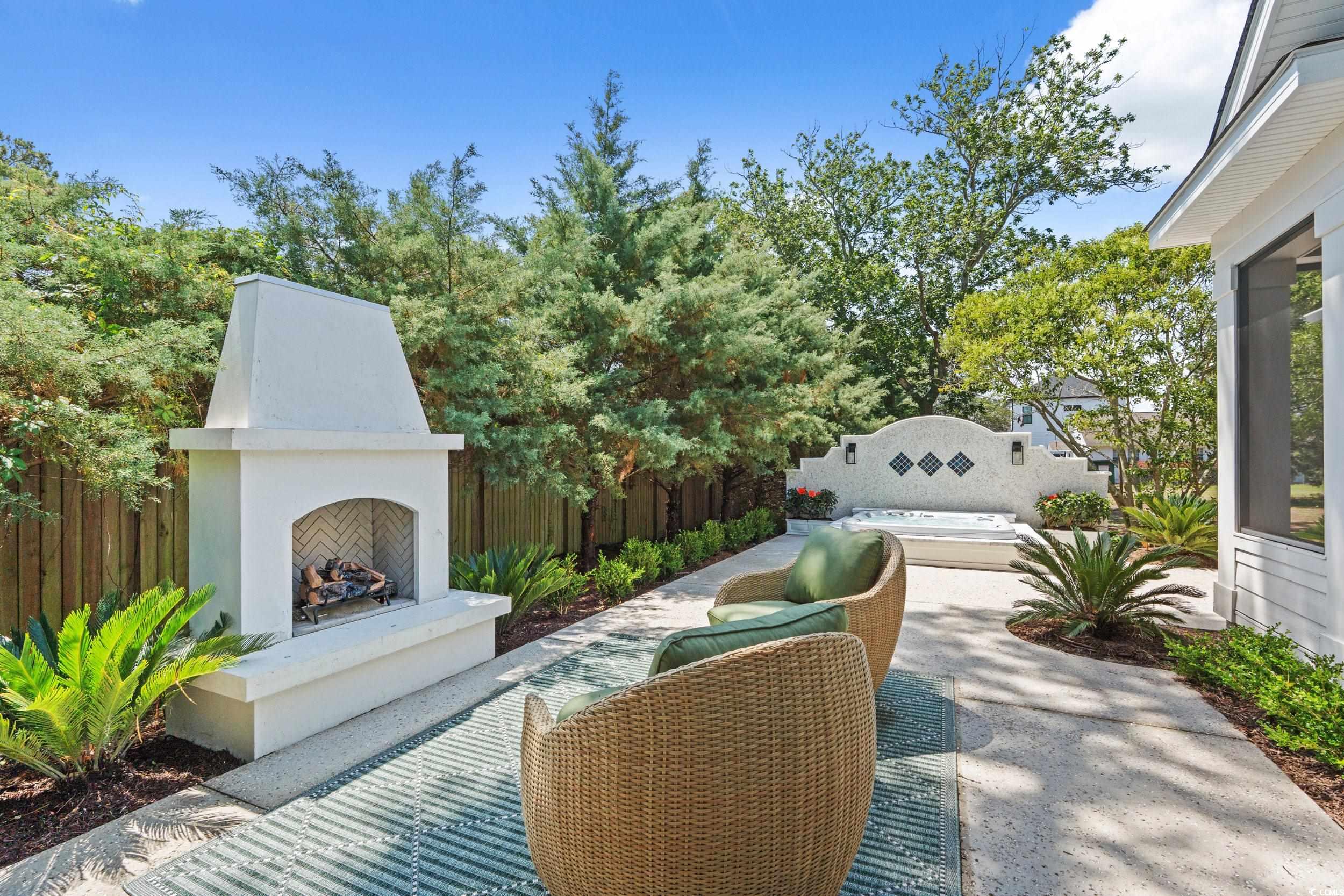 405 North Highland Way Myrtle Beach, SC 29572 - Photo 20 of 40 View of patio featuring exterior fireplace and fence