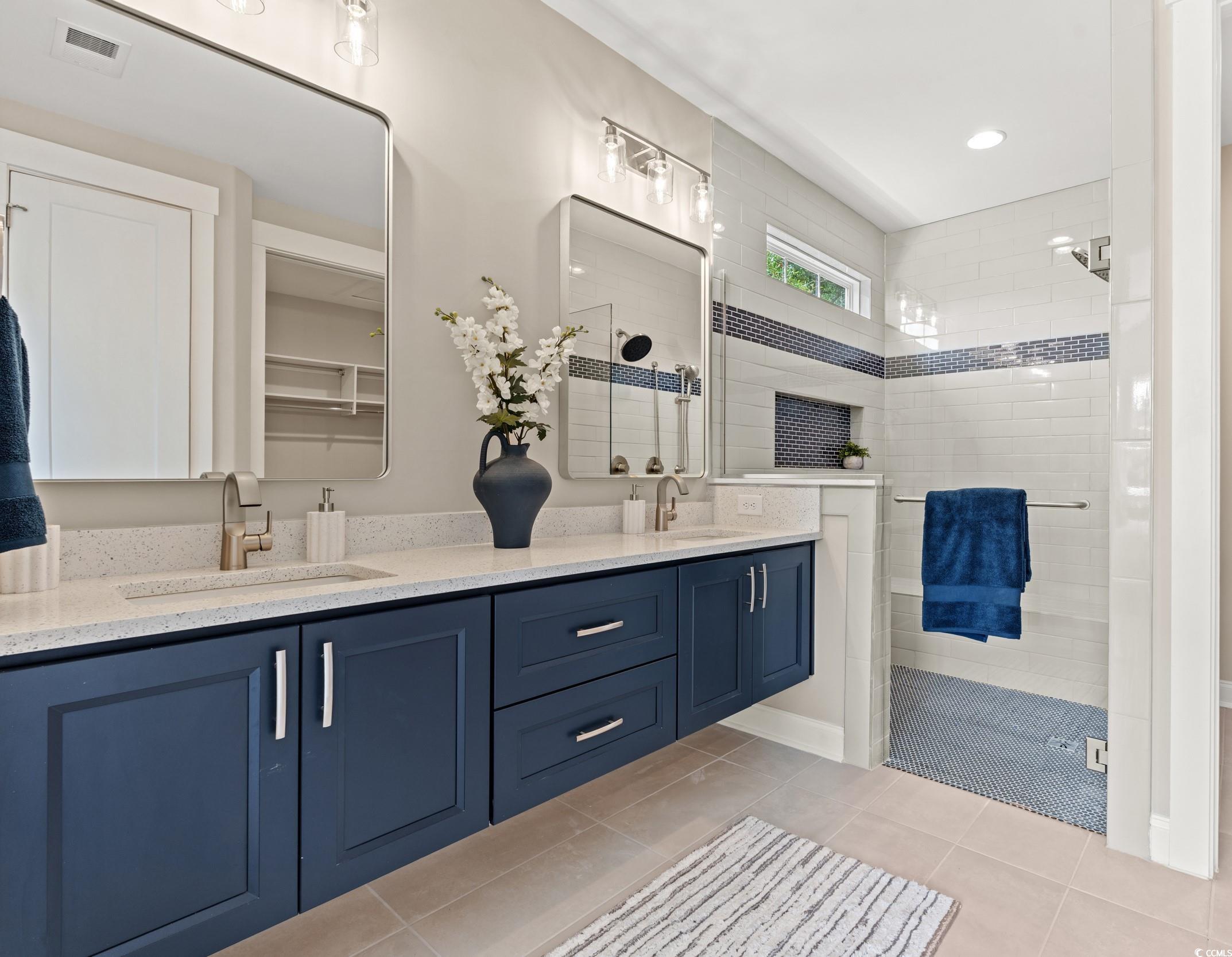 405 North Highland Way Myrtle Beach, SC 29572 - Photo 29 of 40 Full bathroom with tiled shower, double vanity, and tile patterned floors