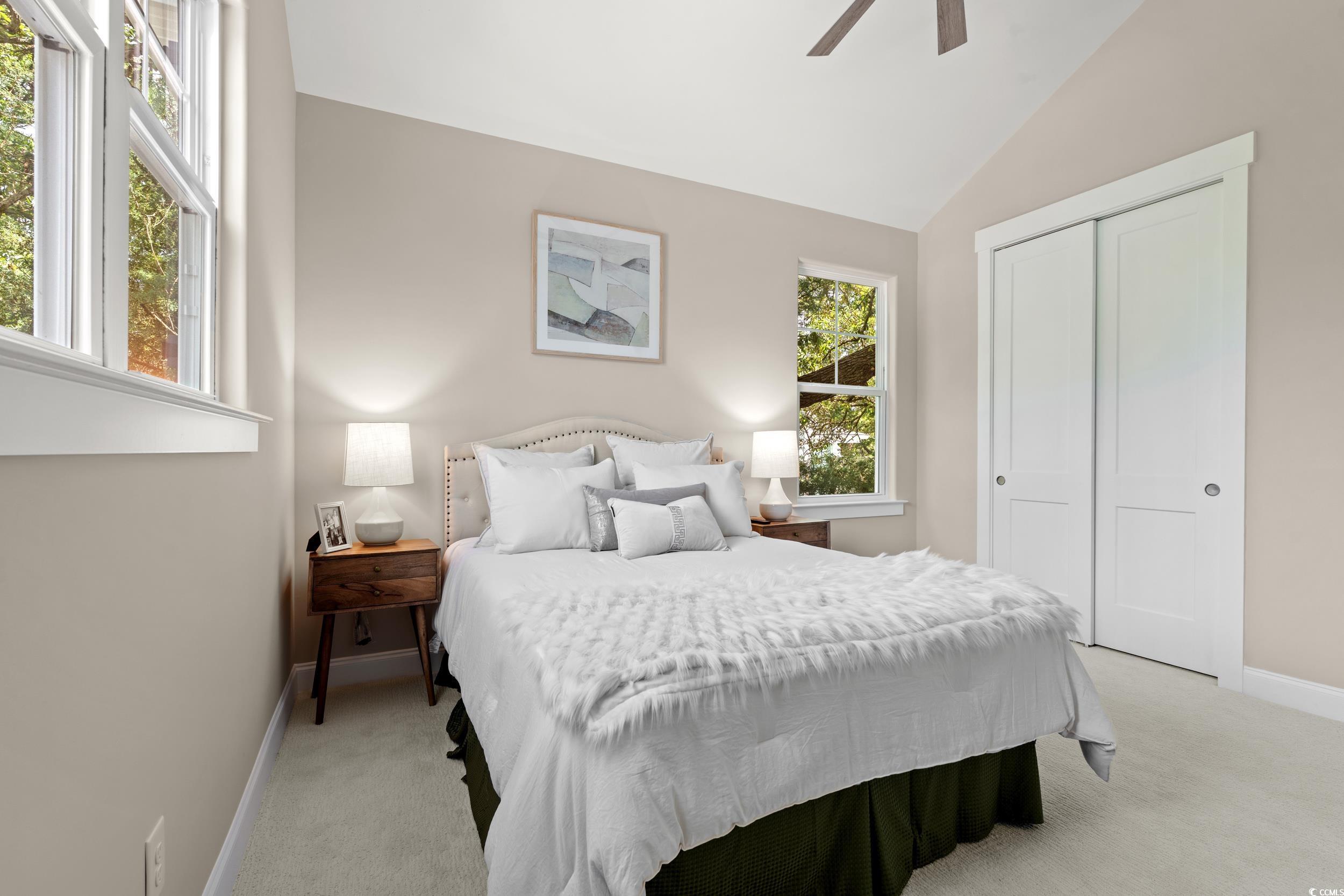405 North Highland Way Myrtle Beach, SC 29572 - Photo 30 of 40 Bedroom featuring light colored carpet, a closet, baseboards, lofted ceiling, and ceiling fan
