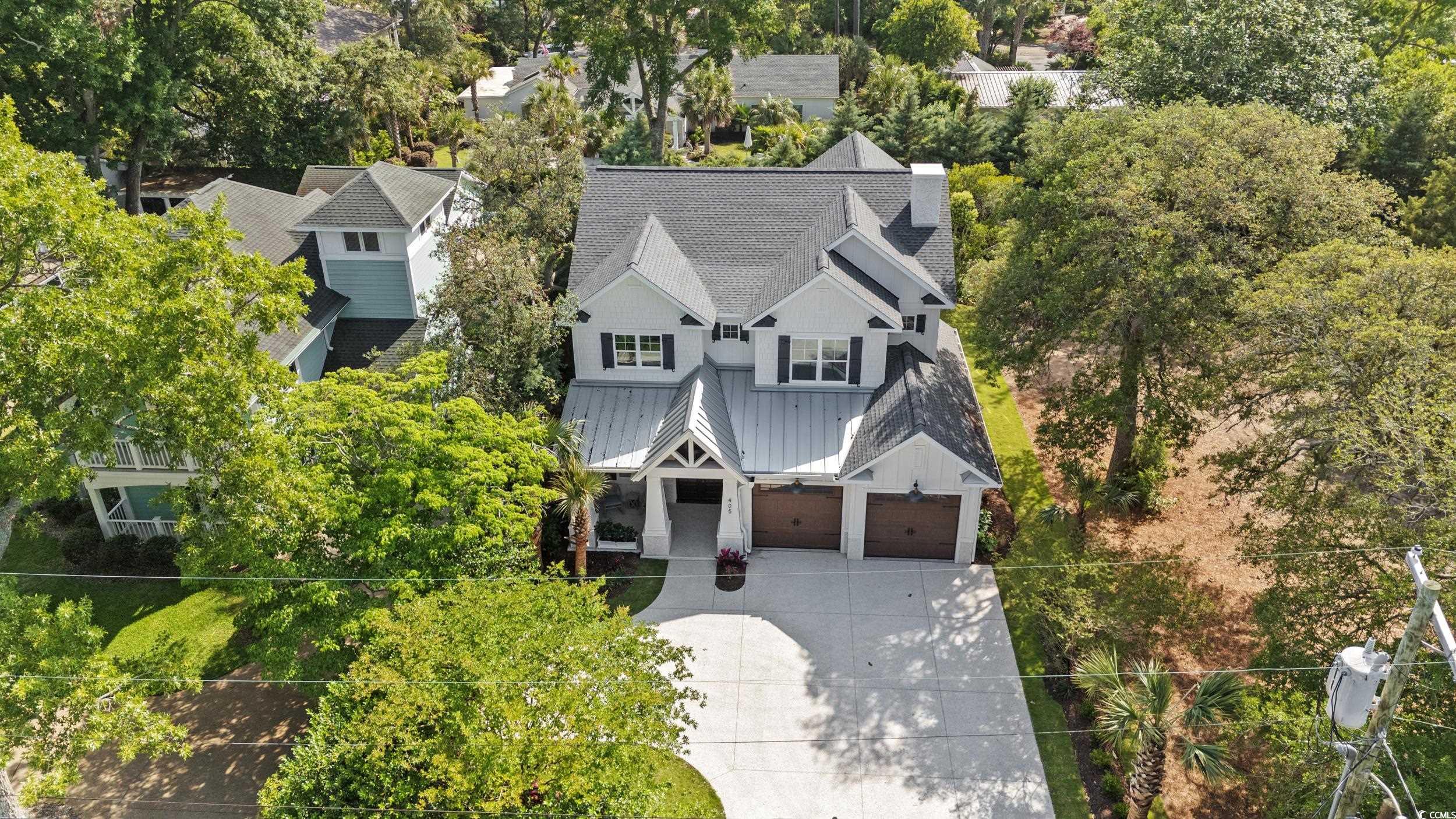 405 North Highland Way Myrtle Beach, SC 29572 - Photo 3 of 40 Aerial view of property and surrounding area with a tree filled landscape