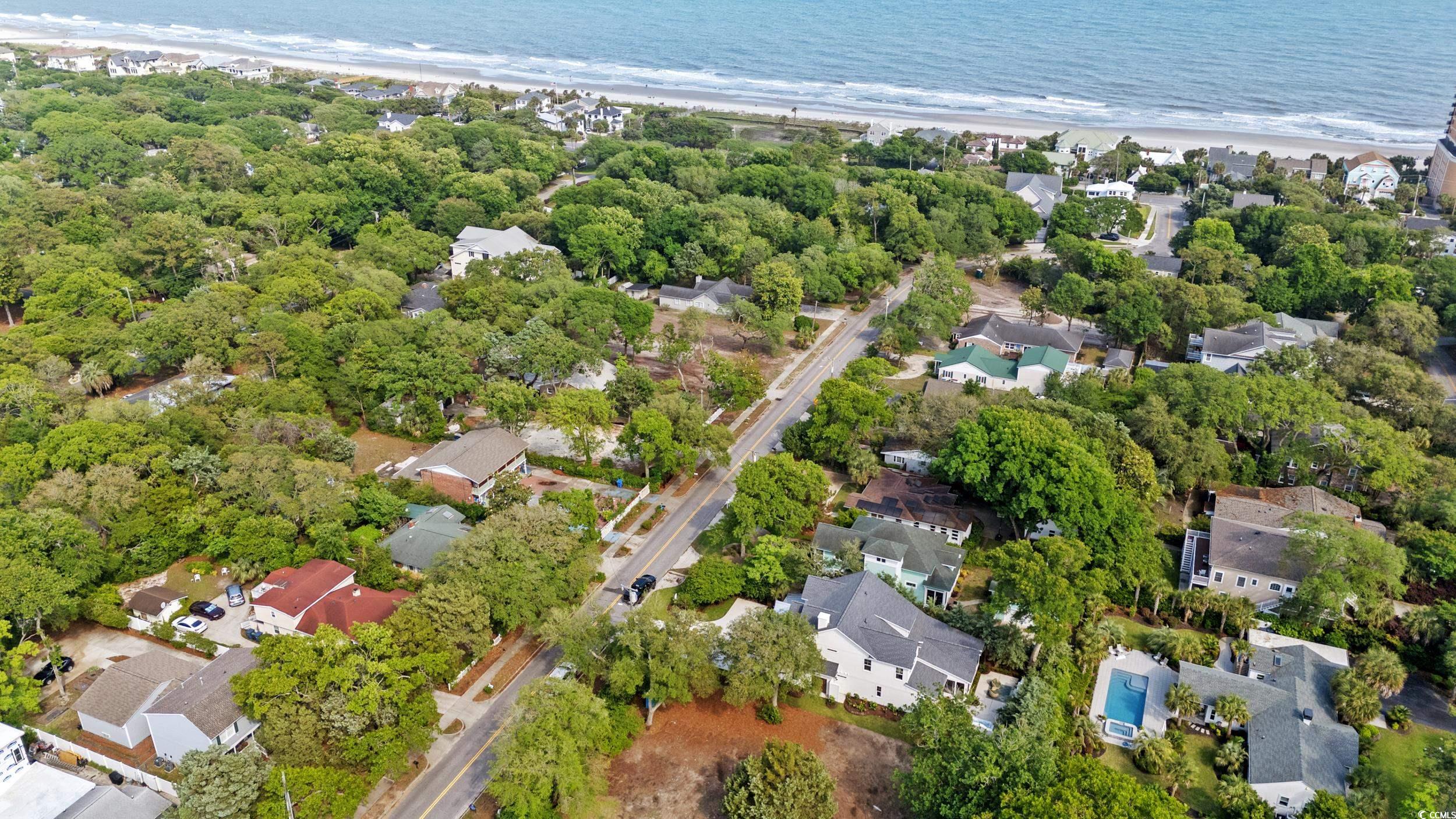405 North Highland Way Myrtle Beach, SC 29572 - Photo 37 of 40 Aerial view of property and surrounding area with expansive coastline and nearby suburban area