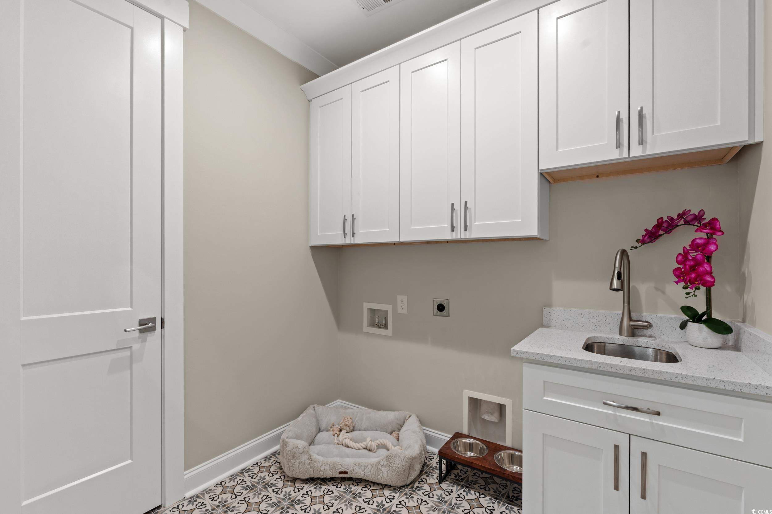 405 North Highland Way Myrtle Beach, SC 29572 - Photo 7 of 40 Clothes washing area featuring hookup for an electric dryer, hookup for a washing machine, cabinet space, and baseboards