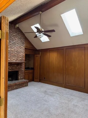 a view of a livingroom with a ceiling fan and a ceiling fan