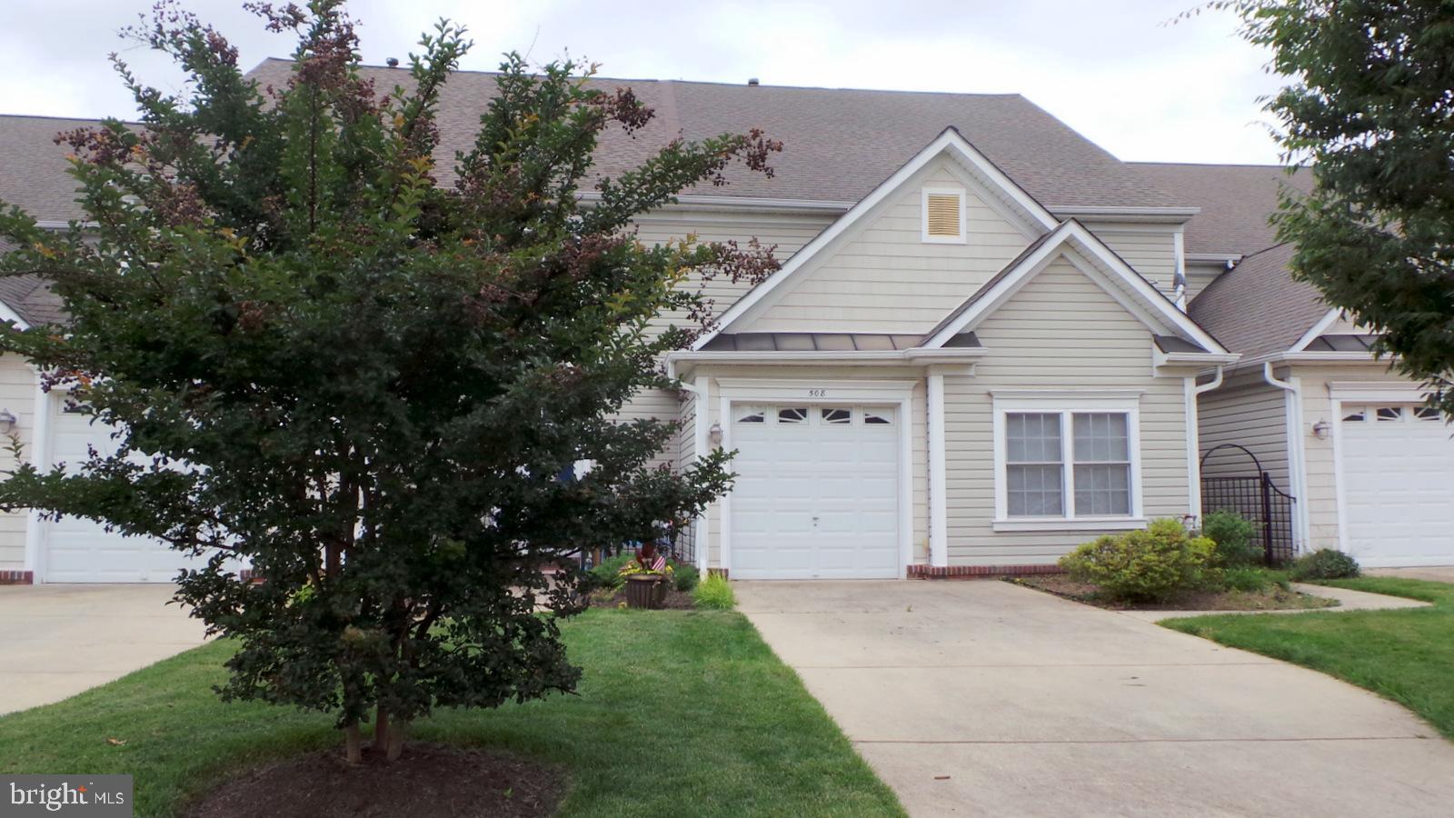 508 Summerset Court, Unit 33 Solomons, MD 20629 - Photo 1 of 36 a front view of a house with a garden