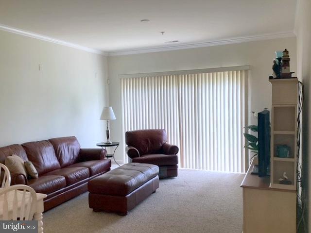 508 Summerset Court, Unit 33 Solomons, MD 20629 - Photo 13 of 36 a living room with furniture and a flat screen tv