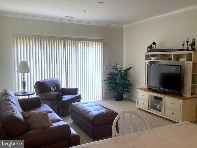 508 Summerset Court, Unit 33 Solomons, MD 20629 - Photo 14 of 36 a living room with furniture and a flat screen tv