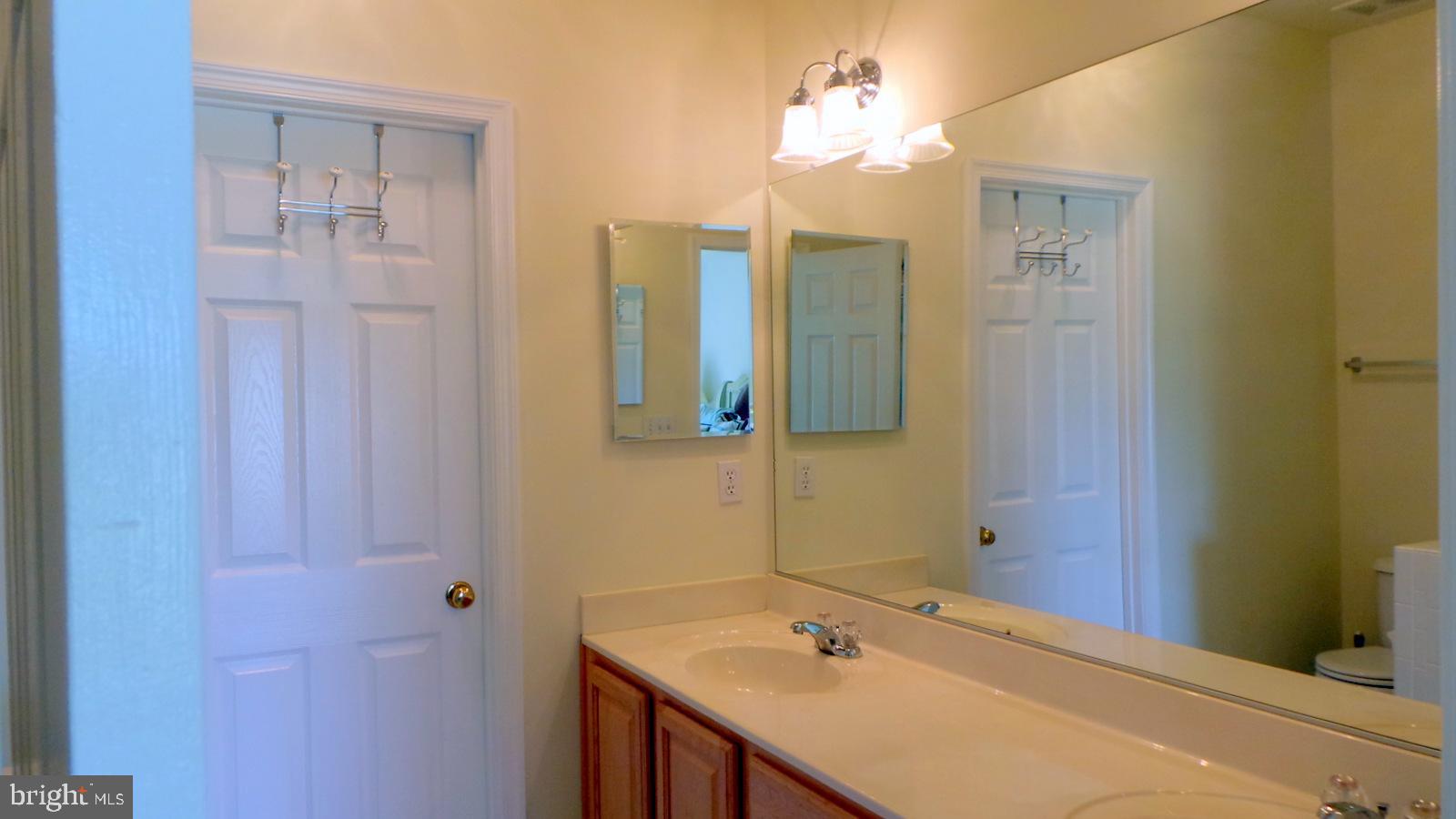 508 Summerset Court, Unit 33 Solomons, MD 20629 - Photo 16 of 36 a bathroom with a sink and a mirror