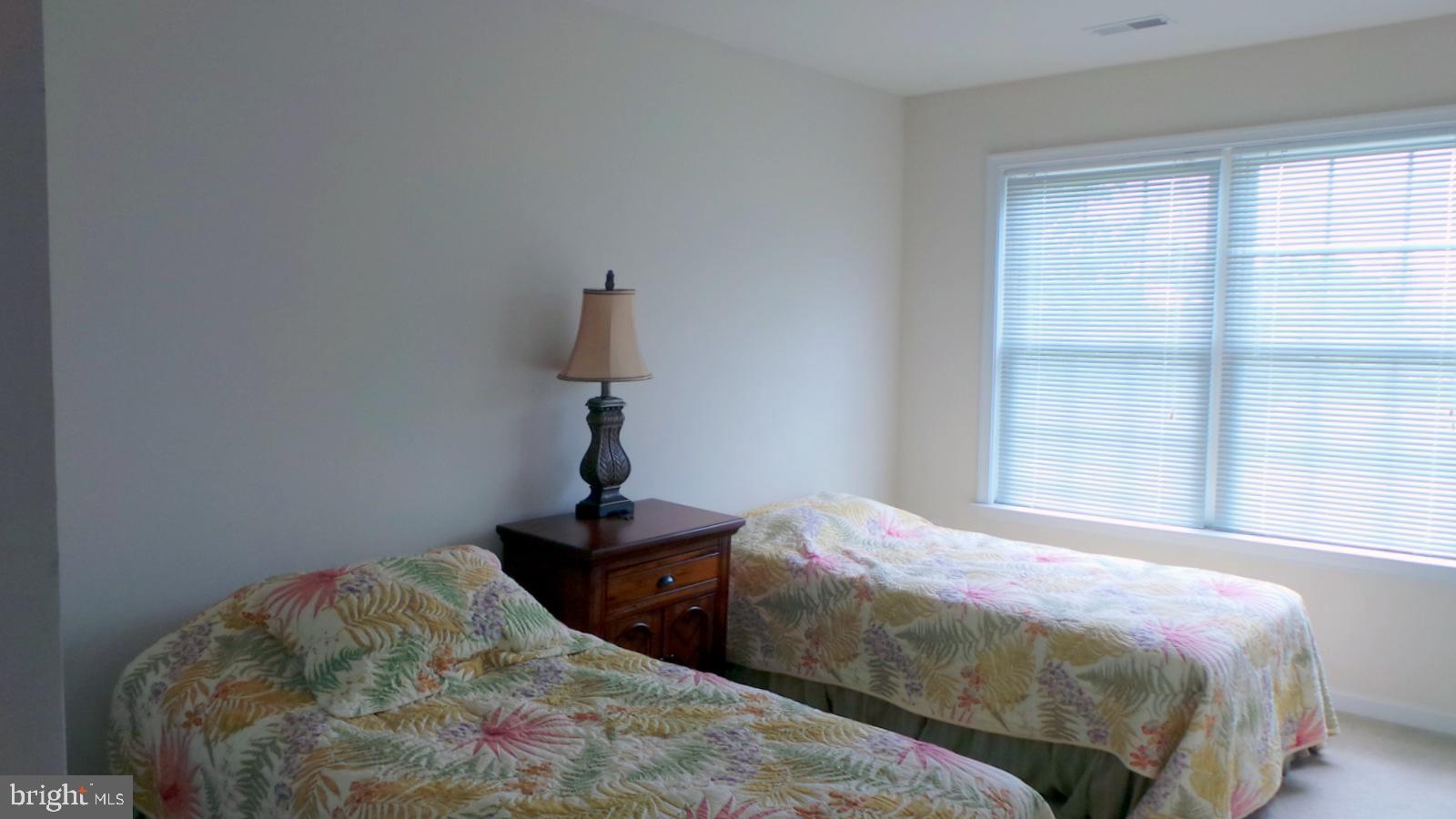 508 Summerset Court, Unit 33 Solomons, MD 20629 - Photo 23 of 36 a bedroom with a bed and a window