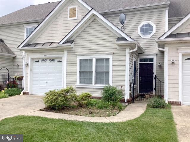 508 Summerset Court, Unit 33 Solomons, MD 20629 - Photo 31 of 36 a front view of a house with a yard