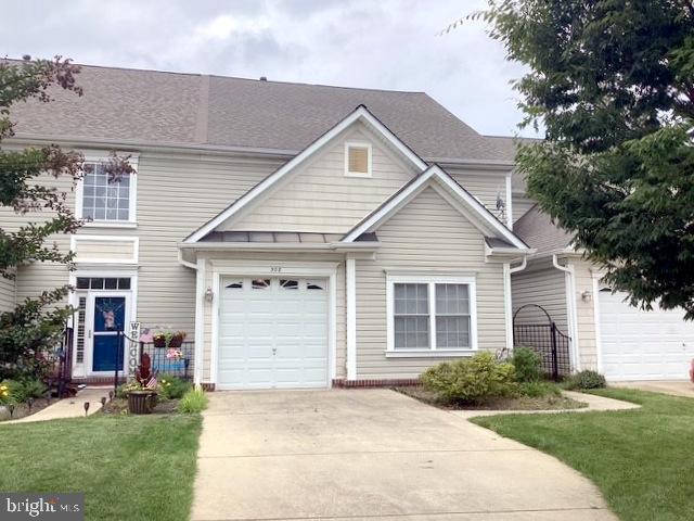 508 Summerset Court, Unit 33 Solomons, MD 20629 - Photo 32 of 36 a view of a house with a yard and garage