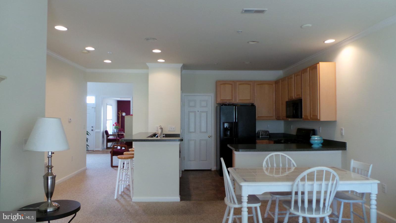 508 Summerset Court, Unit 33 Solomons, MD 20629 - Photo 8 of 36 a view of a dining room with furniture