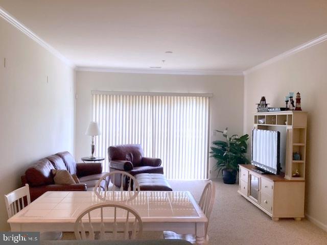 508 Summerset Court, Unit 33 Solomons, MD 20629 - Photo 9 of 36 a living room with furniture and a flat screen tv