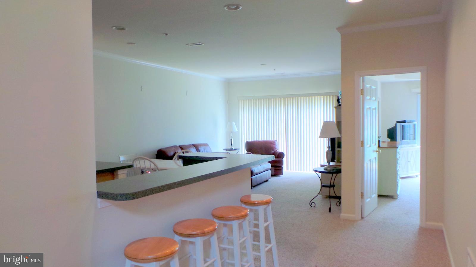 508 Summerset Court, Unit 33 Solomons, MD 20629 - Photo 10 of 36 a room with furniture and a table