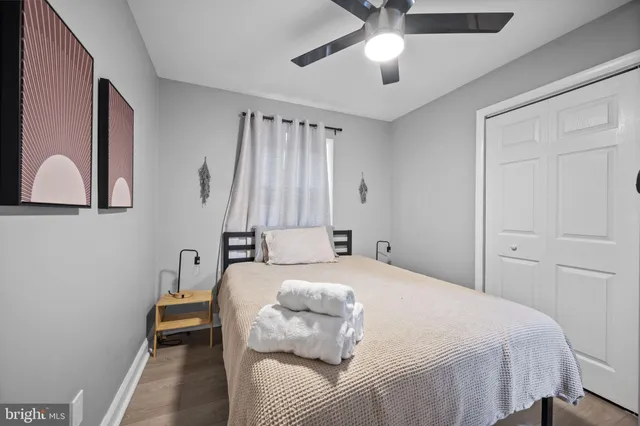 a bedroom with a bed and a dresser