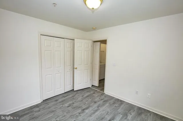 an aerial view of a house with garden space ocean and mountain view in back