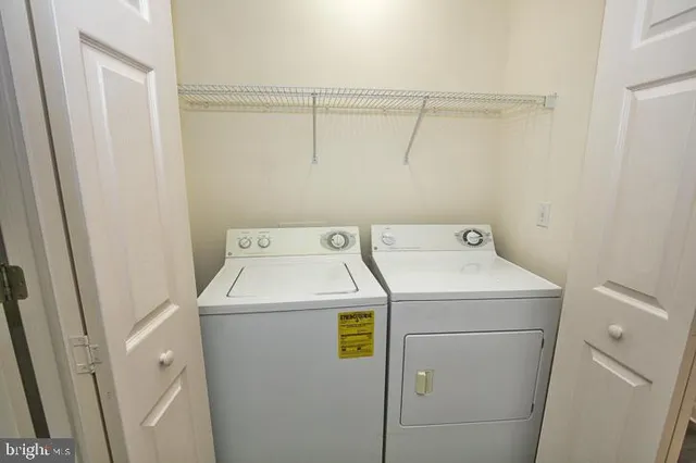 an aerial view of a house with yard