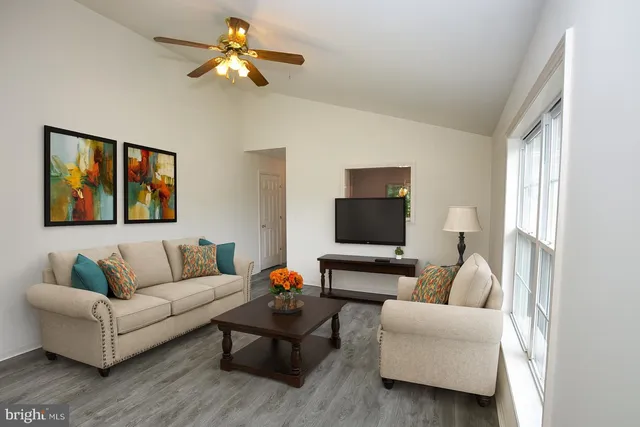 a living room with furniture and a window